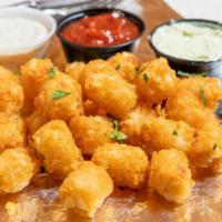 Tots · Three sauces: cherry pepper ketchup, black pepper ranch, and rosemary & chive aioli.