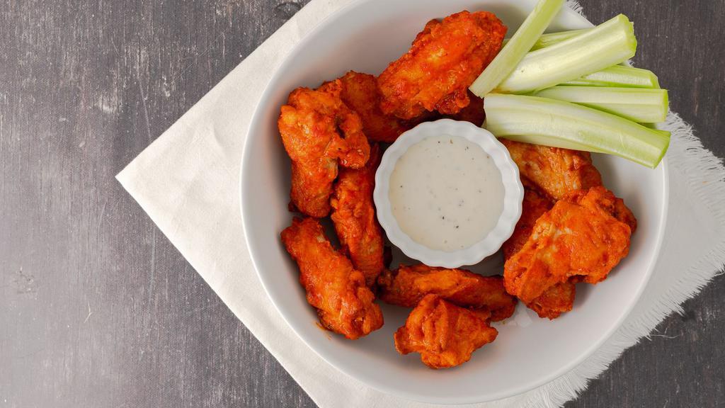Hot Wings · Choose from chef's buffalo sauce, gochujang sauce, or get them with our famous'Tennessee Hot' Your choice of house-made bleu cheese or ranch. (1 dozen, deep fried to order)