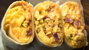 Breakfast Burrito · 3 scrambled eggs, cheddar cheese, bacon or ham.