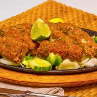 Seekh Kabab · Finely slices lamb seasoned with chopped onions, herbs, and spices. Served with saffron flav...