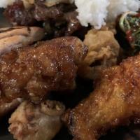 Chicken Wings W/ Hot Or Regular Sauce · Hot and spicy dish.