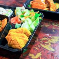 Seame Chicken Bento Box · Served with soup, green salad, Crab Rangoon, a six-piece California roll and boiled rice.
