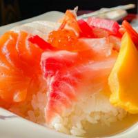 Chirashi · Assorted of fresh sashimi over sushi rice. Served with miso soup or green salad.