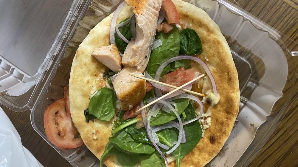 Edinburgh* (501 Calories) · Grilled Scottish salmon, toasted pita, roasted tomato aioli, organic spinach, diced red onion, side tomato slices with Balsamic glaze