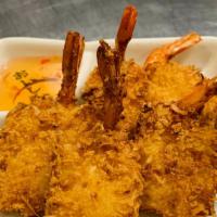 Coconut Shrimp · Shrimp crusted with coconut flakes, deep fried until golden brown. Served with homemade plum...