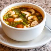 Tom Yum Goong · Less spicy. The famous thai hot and sour soup with shrimp, chili, lemongrass, tomatoes, mush...