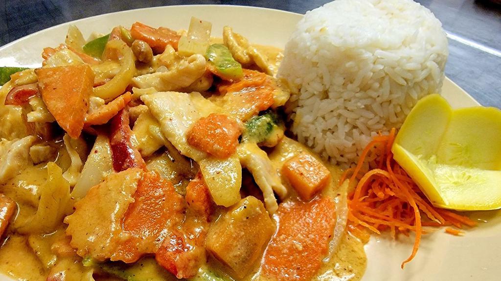 Massaman Curry · Less spicy. Massaman curry and coconut milk with carrots, onion, red-green peppers, potatoes, and roasted peanuts.
