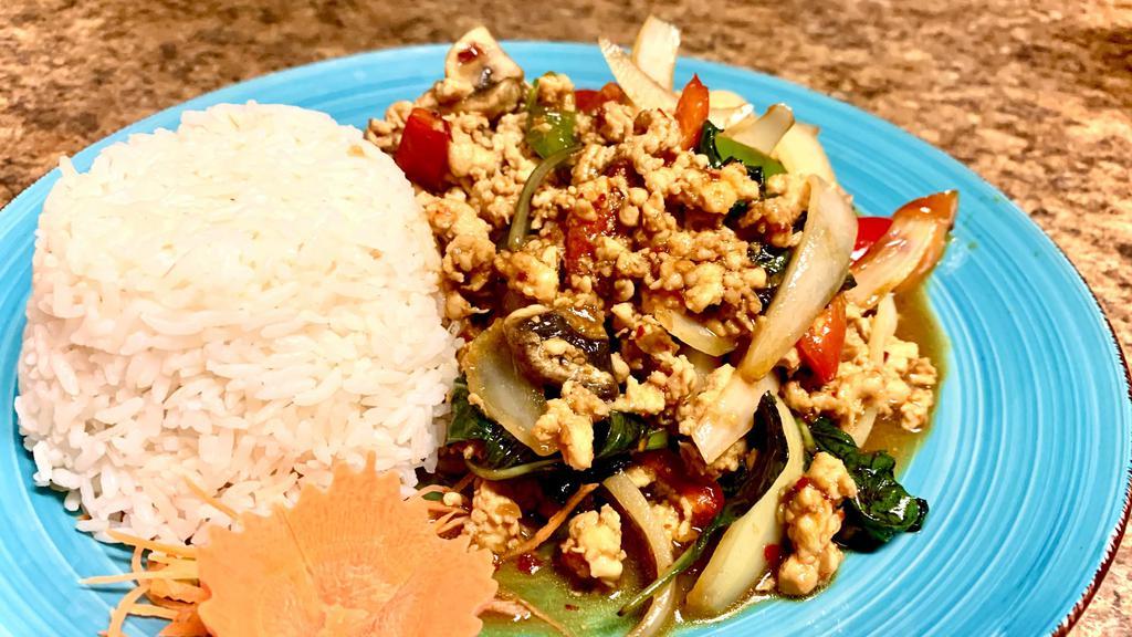 Chicken Gaprow · Thai style spicy minced chicken in chili garlic sauce with red-green peppers, onions, mushrooms, and sweet basil leaves.