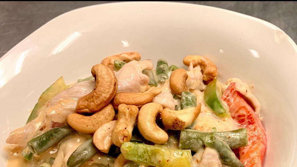 Spicy String Beans · Less spicy. Tender sliced pork in mild red curry sauce. Green beans, red-green peppers, snow peas, ground peanuts, and roasted cashew nuts.