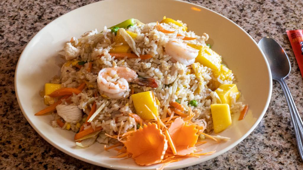 Mango Fried Rice · House special fried rice with shrimps, chicken, mangoes, onions, carrots, ginger, green peas, scallion, and egg.