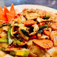 Crazy Noodle · Medium spicy. Flat rice noodles, onions, green beans, red-green peppers, basil leaves, carro...