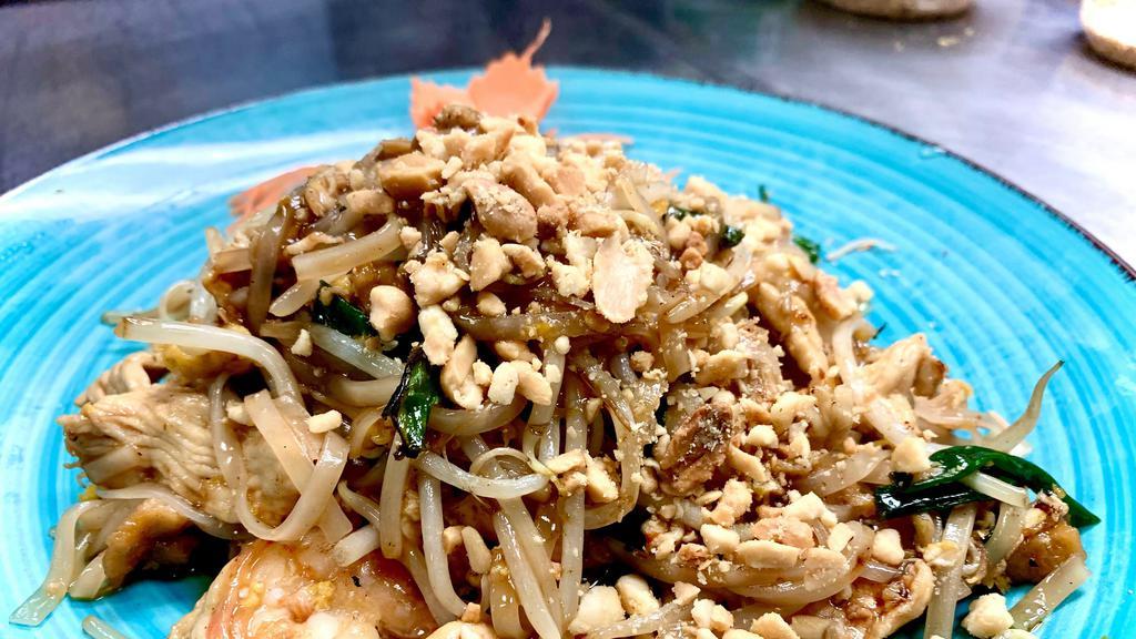 Pad Thai (Country Style) · Less spicy. An authentic spicy version of pad thai with egg, chicken and shrimps, bean sprouts, scallion, ground peanuts plus extra ingredients of fried tofu.