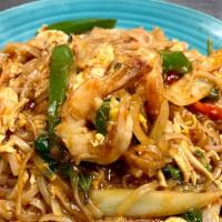 Spicy Pad Thai · Rice noodle stir fried with egg, chicken, and shrimp, with spicy pad thai sauce, onion, gree...