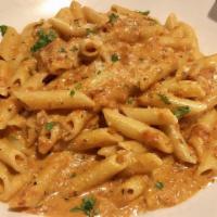 Penne Alla Vodka With Prosciutto · Vodka with prosciutto in blush sauce tossed with penne.