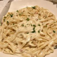 Fettuccine Carbonara · Pancetta bacon, with shallots in Parmesan cream sauce.