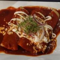 Enchiladas Rojas · Three corn tortillas stuffed with chicken, red sauce, Mexican cheese, onions, cilantro, and ...