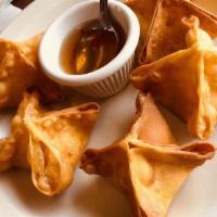 Crab Rangoon (6) · Crabmeat with cream cheese in crispy wonton wraps, served with sweet & sour sauce.