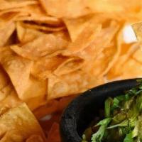 Guacamole · Avocado, cilantro, onion, jalapeno, garlic, lime juice. Served with house-made tortilla chips.