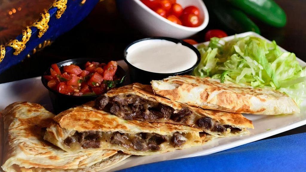 Steak Quesadillas · Flour tortilla, quesillo, Mexican crema, pico de gallo