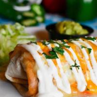 Veggie Chimichanga · Pan-fried flour tortilla stuffed with onion, chipotle sauce. Topped with mixed cheese, crema...
