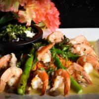 Tequila Shrimp · Tequila-flamed shrimp, mushrooms, asparagus. Served with red rice y black beans.