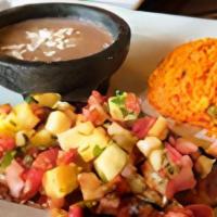 Blackened Chicken Entree · Blackened grilled chicken breast, pineapple y tomato salsa. Served with Mexican red rice y r...