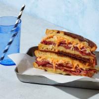 Reuben Grilled Cheese · Melted swiss cheese with pastrami, sauerkraut, and thousand island dressing between two slic...