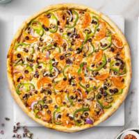 Veggie Feast Pizza · Mushrooms, eggplant, black olives, green peppers, tomatoes, and broccoli baked on a hand-tos...