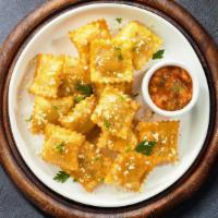 Freaky Fried Ravioli · (Vegetarian) Cheese-filled ravioli breaded and fried until golden brown. Served with housema...
