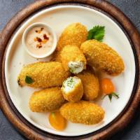 Hot Shot Poppers · (Vegetarian) Fresh jalapenos coated in cream cheese and fried until golden brown.