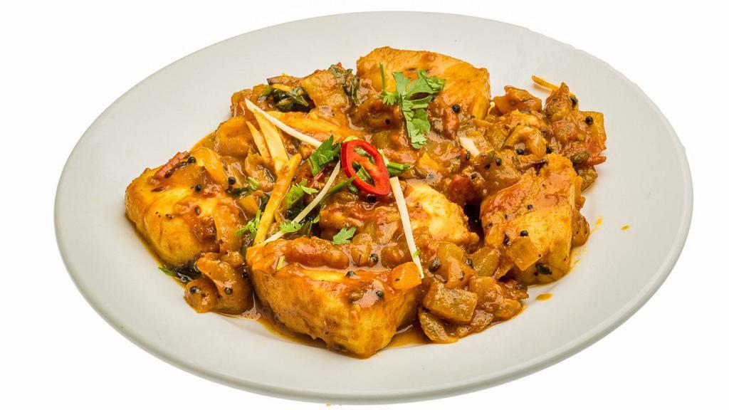 Fish Masala (Salmon) · Masala salmon fish cooked in a hearty blend of tangy tomatoes, onions with aromatic herbs and spices.