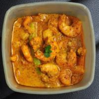 Shrimp Vindaloo · Masala hot, spicy and tangy shrimp curry. Served with a side of basmati rice.