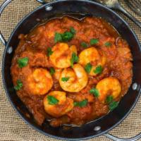 Shrimp Tikka Masala · Masala shrimp cooked in clay oven, sautéed with tomatoes, green pepper and onion in rich cre...