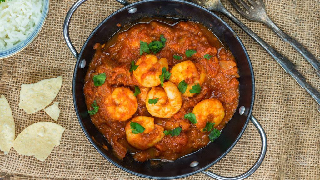 Shrimp Tikka Masala · Masala shrimp cooked in clay oven, sautéed with tomatoes, green pepper and onion in rich creamy sauce.
