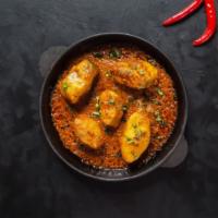Fish Masala (Tilapia) · Tilapia Fish cooked in a hearty blend of tangy tomatoes, onions with a blend of herbs and sp...
