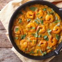 Shrimp Bhuna · Perfectly prepared shrimp cooked with tomatoes, onions, fresh herbs and spices. Served with ...