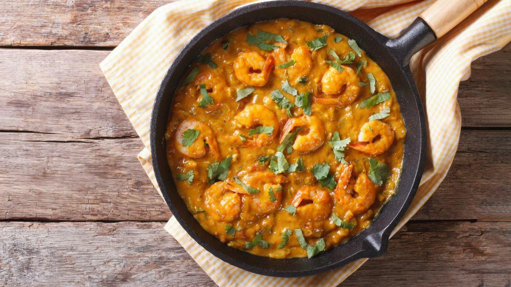 Shrimp Bhuna · Perfectly prepared shrimp cooked with tomatoes, onions, fresh herbs and spices. Served with a side of basmati rice.