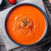Tomato Soup · Perfectly prepared traditional soup made with tomato paste and delicate herbs.