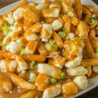 Poutine · (14) oz. Extra crispy fries topped with melted Quebec cheddar cheese curd and beef gravy.