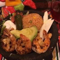 Ceviche · Mexican style shrimp cocktail served with sliced avocado and nachos.