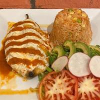 Chile Relleno · Battered poblano pepper stuffed with cheese and topped with hot or mild sauce. Served with r...