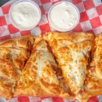 Buffalo Chicken Calzone · Made with ricotta cheese and served with marinara sauce on the side.