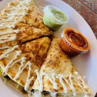 Quesadillas · Flour tortilla filled with oaxaca cheese, served with lettuce & sour cream. Beef, pork, chic...