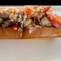 Surf & Turf Lobster Roll · Marinated steak and sweet lobster meat on a perfectly toasted bun w/horseradish mayo.