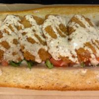 Shrimp Po'Boy · French baguette filled with fried shrimp, lettuce & tomato topped with homemade remoulade.