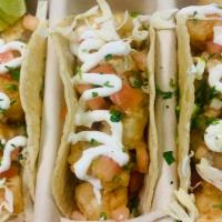 Baja Tacos · Our take on baja taco featuring tempura shrimp, shredded pickle cabbage, pico de gallo and t...