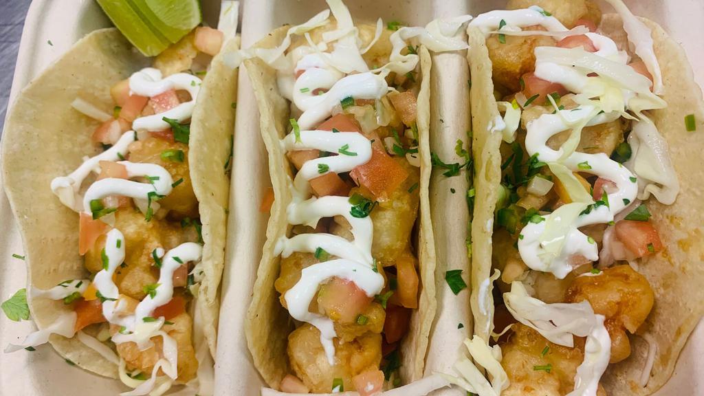 Baja Tacos · Our take on baja taco featuring tempura shrimp, shredded pickle cabbage, pico de gallo and topped with sour cream. 3 per order.