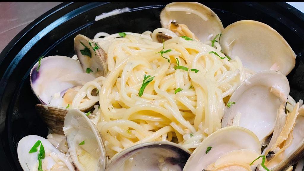 Linguini & Clams  · with white wine, butter, garlic & shallots topped with Italian Parsley.