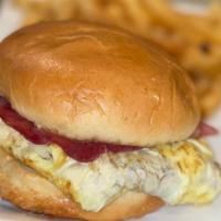 Egg & Cheese On A Roll · Scrambled eggs, American cheese on a brioche bun served with home fries.