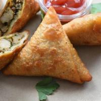 Chicken Samosa (2 Pcs) · Handmade pastry filled with sautéed seasoned minced chicken. Served with green and red chutn...
